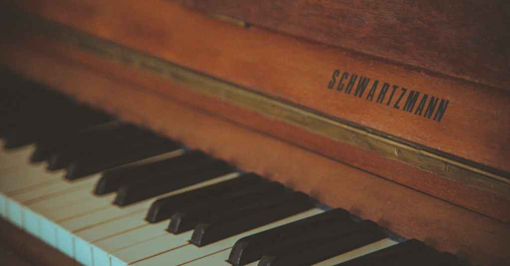 Close-up of a vintage Schwartzmann piano showcasing its classic wooden design and keyboard.